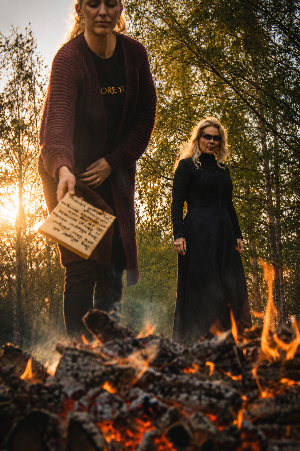 Outdoor fire ceremony gathering in the Swedish forest