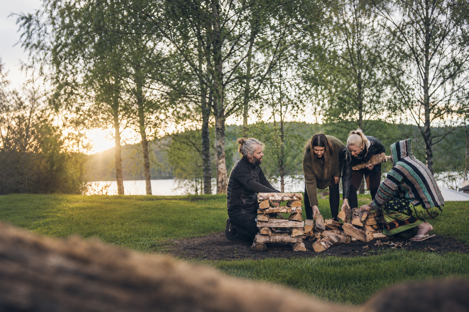 Group gathered around a fire at dusk